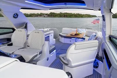 Slide: The Image of Luxurious interior of 2024 Sea Ray SLX 400 yacht with seating and dining area. - 78