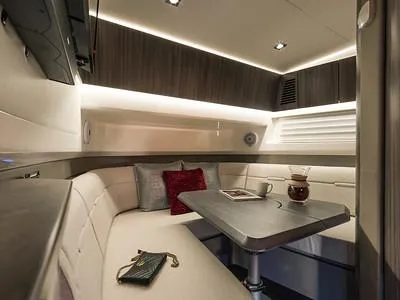 Slide: The Image of Luxurious interior of 2024 Sea Ray SLX 400 yacht with cozy seating and modern decor. - 83