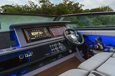 Slide: The Image of 2024 Sea Ray SLX 400 helm with advanced navigation system and luxurious seating. - 87