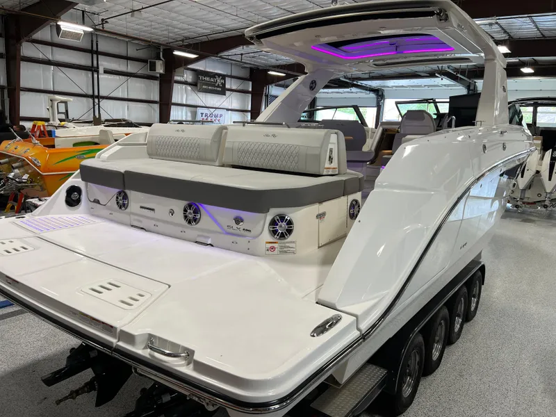 Slide: The Image of 2024 Sea Ray SLX 400 luxury boat with sleek design and modern features in a showroom. - 9