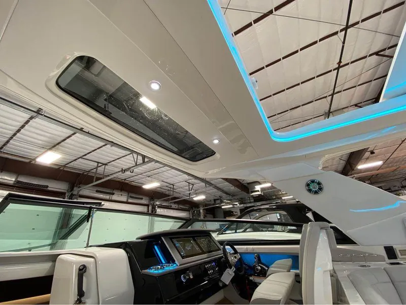 Slide: The Image of 2024 Sea Ray SLX 400 boat interior with modern dashboard and seating. - 93
