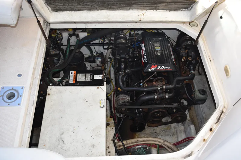 Slide: The Image of Engine compartment of a 2003 Bayliner 305 boat with a MerCruiser 5.0L engine. - 25