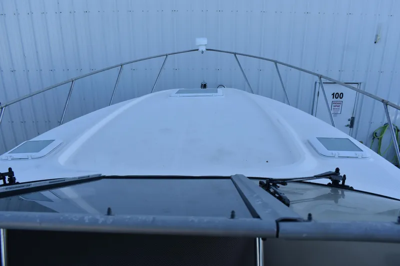 Slide: The Image of 2003 Bayliner 305 boat bow view in storage facility. - 33