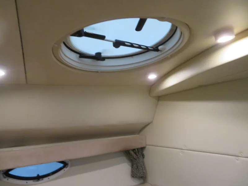 Slide: The Image of Interior cabin view of 2005 Maxum 3300 SE boat with circular skylight. - 10