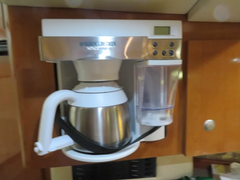 Slide: The Image of Built-in coffee maker in a 2005 Maxum 3300 SE boat kitchen. - 12
