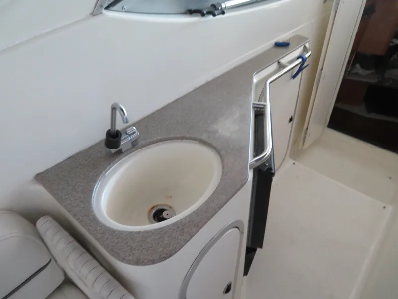 Slide: The Image of 2005 Maxum 3300 SE boat interior with sink and countertop. - 17