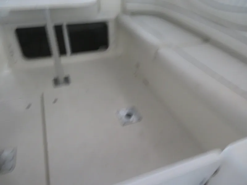 Slide: The Image of 2005 Maxum 3300 SE boat interior with seating and table. - 20