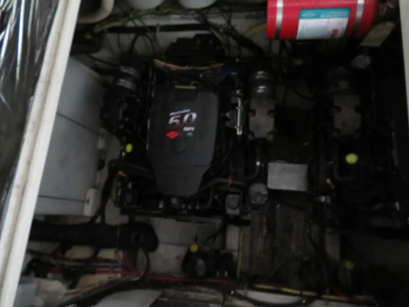 Slide: The Image of Engine compartment of a 2005 Maxum 3300 SE boat with visible machinery. - 21