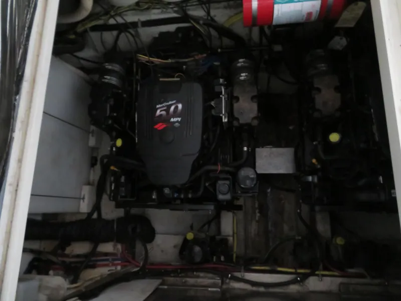 Slide: The Image of Engine compartment of a 2005 Maxum 3300 SE boat, featuring a MerCruiser 5.0 MPI engine. - 22