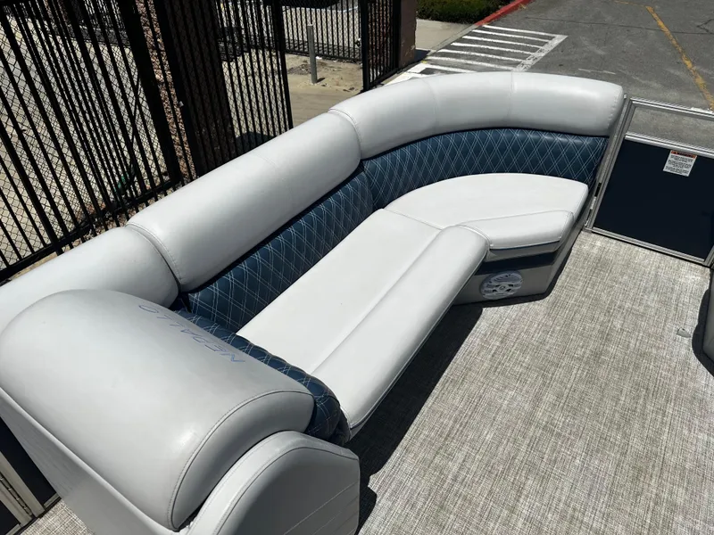 Slide: The Image of 2022 Nepallo CW24-ST24QL boat with white and blue cushioned seating. - 10