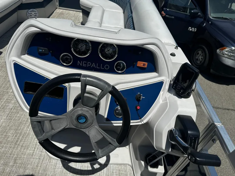 Slide: The Image of Nepallo CW24-ST24QL 2022 boat dashboard with steering wheel and control panel. - 15