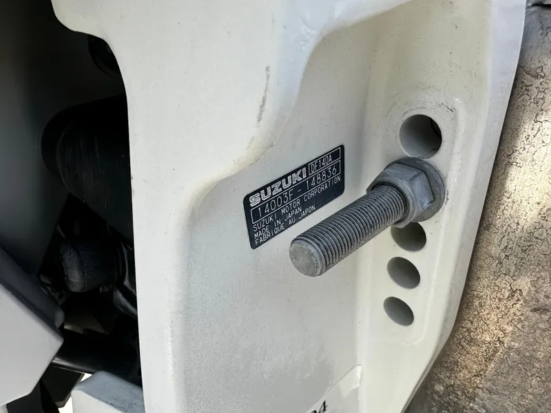 Slide: The Image of Close-up of a 2022 Nepallo CW24-ST24QL engine bolt and identification plate. - 19