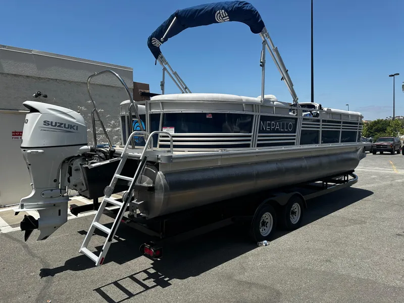 Slide: The Image of 2022 Nepallo CW24-ST24QL pontoon boat with Suzuki outboard motor. - 2