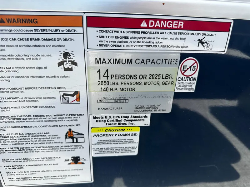 Slide: The Image of Warning and capacity labels on a 2022 Nepallo CW24-ST24QL boat. - 21