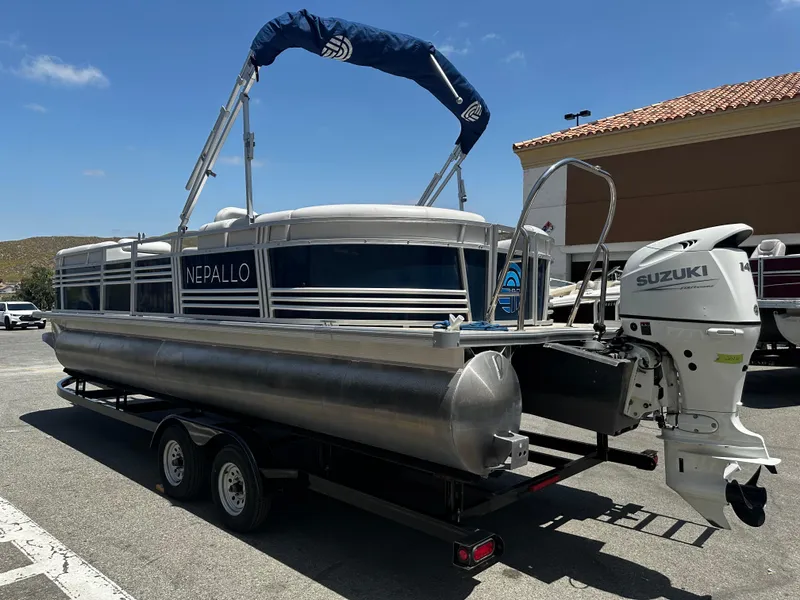 Slide: The Image of 2022 Nepallo CW24-ST24QL pontoon boat on trailer with Suzuki outboard motor. - 4