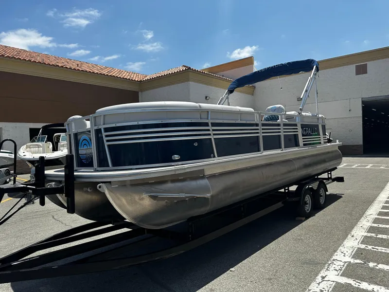 Slide: The Image of 2022 Nepallo CW24-ST24QL pontoon boat on a trailer in a parking lot. - 5