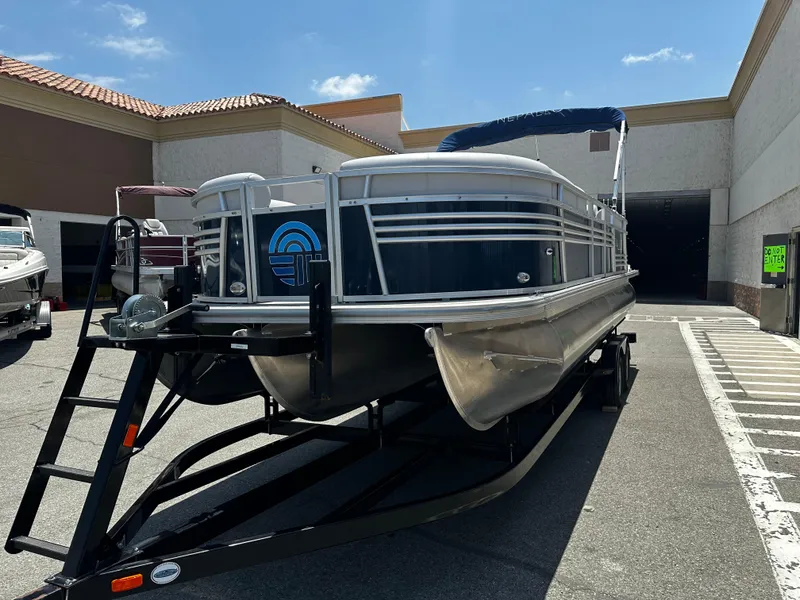 Slide: The Image of 2022 Nepallo CW24-ST24QL pontoon boat on a trailer in a parking lot. - 6
