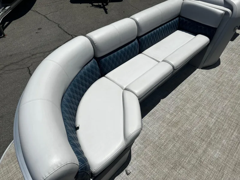 Slide: The Image of 2022 Nepallo CW24-ST24QL boat with white and blue cushioned seating. - 9