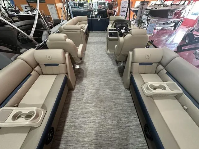 Slide: The Image of 2024 Godfrey Sweetwater 2286 SB GTP pontoon boat interior with plush seating and modern helm. - 14