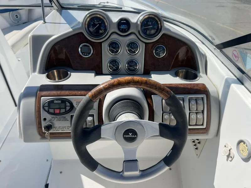 Slide: The Image of 2006 Formula 240 Bowrider dashboard with steering wheel and instrument panel. - 13