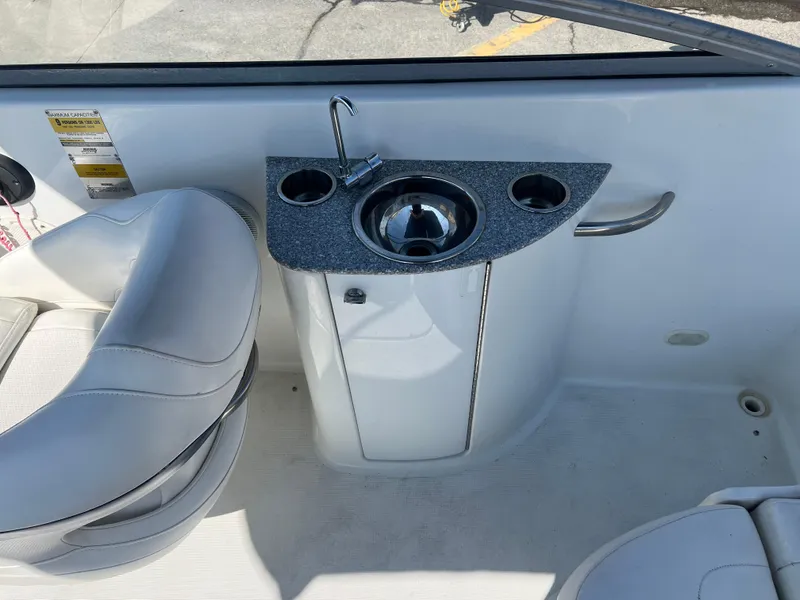 Slide: The Image of 2006 Formula 240 Bowrider interior with sink and seating area. - 15