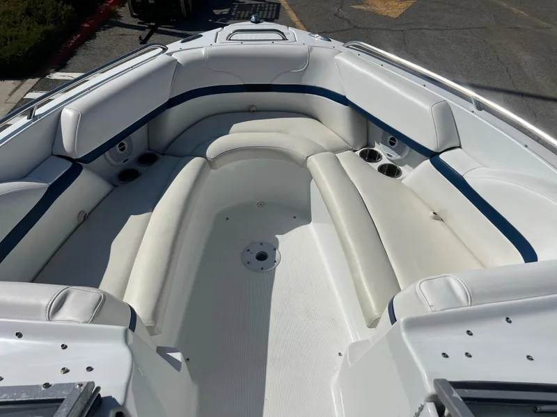 Slide: The Image of 2006 Formula 240 Bowrider boat with spacious seating area and cup holders. - 20