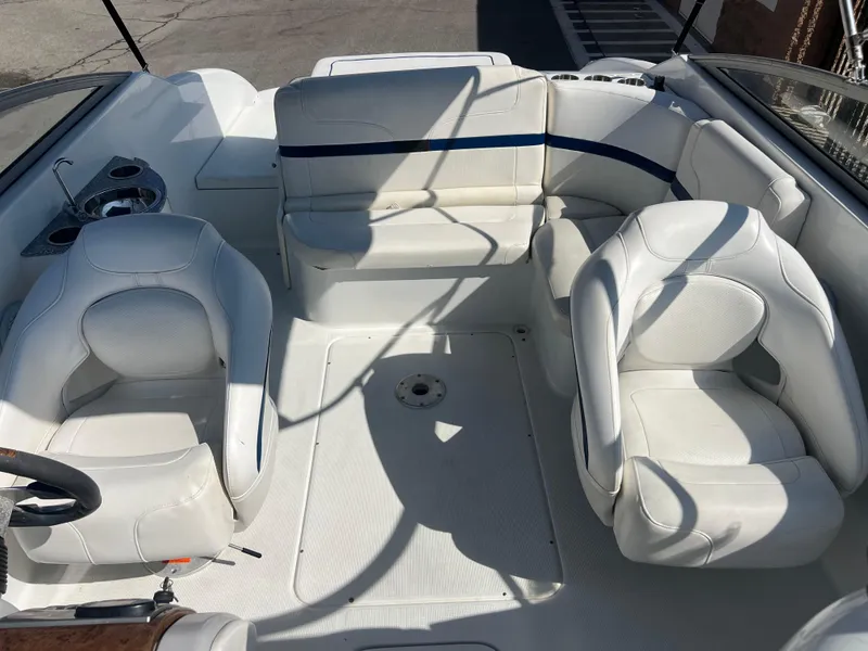 Slide: The Image of 2006 Formula 240 Bowrider interior with white seating and spacious layout. - 21