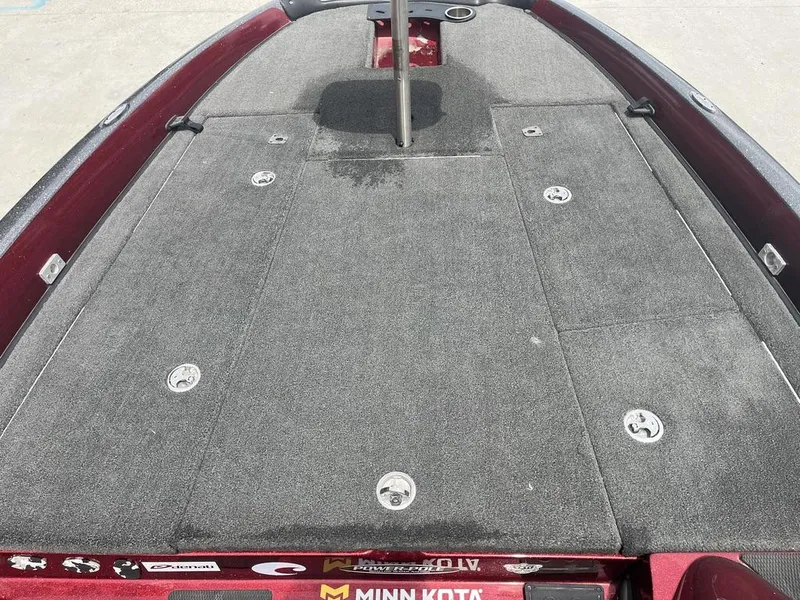 Slide: The Image of 2016 Stratos 201 XL Evolution boat deck with gray carpet and storage compartments. - 10