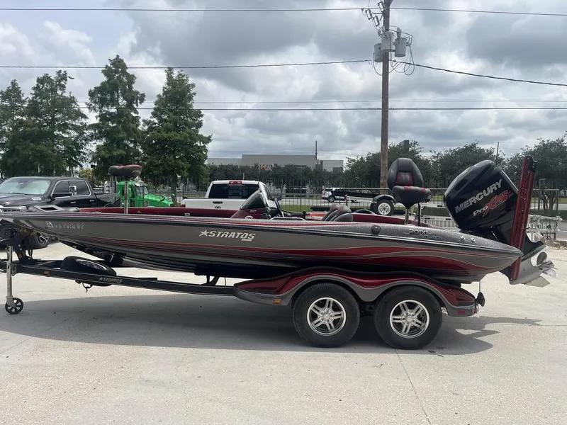 Slide: The Image of 2016 Stratos 201 XL Evolution bass boat on trailer with Mercury Pro XS outboard motor. - 12