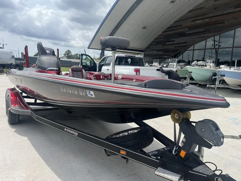Slide: The Image of 2016 Stratos 201 XL Evolution boat on a trailer, parked outside a dealership. - 14