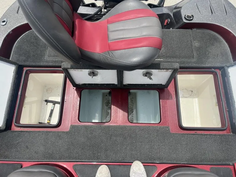 Slide: The Image of 2016 Stratos 201 XL Evolution boat interior with storage compartments and seating. - 18