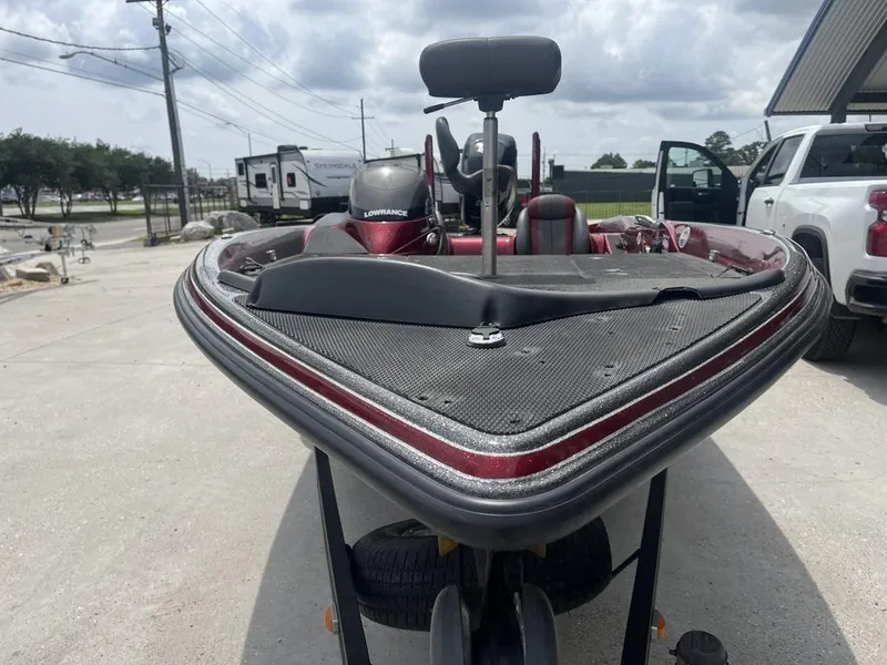 Slide: The Image of 2016 Stratos 201 XL Evolution boat parked outdoors, front view. - 8