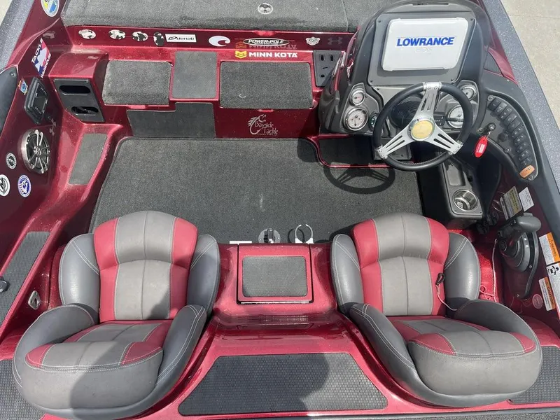 Slide: The Image of 2016 Stratos 201 XL Evolution boat interior with dual seats, steering console, and Lowrance electronics. - 9