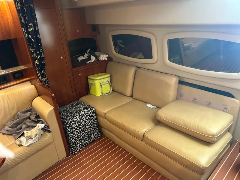 Slide: The Image of Interior of 2009 Cruisers 390 Sportcoupe with beige leather seating and wooden accents. - 23