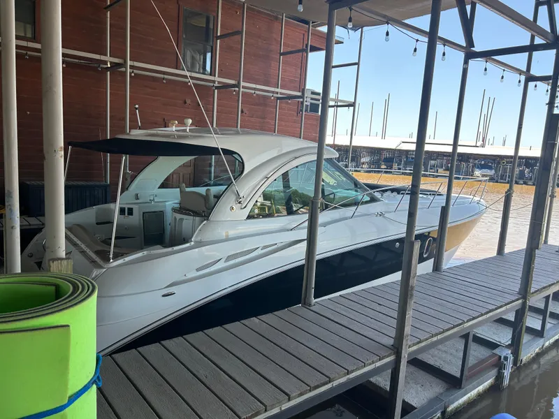 Slide: The Image of 2009 Cruisers 390 Sportcoupe docked at marina, side view. - 3