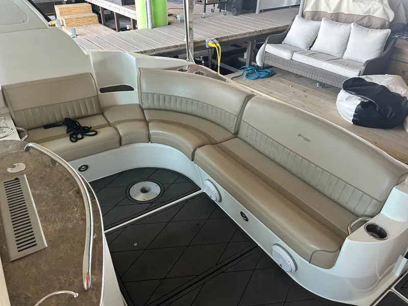 Slide: The Image of 2009 Cruisers 390 Sportcoupe boat with beige leather seating and modern deck design. - 10