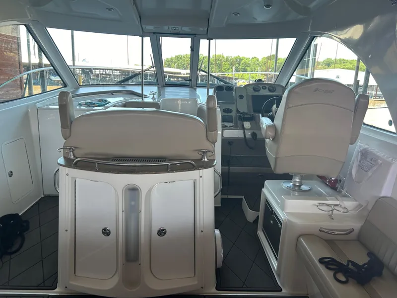 Slide: The Image of Interior of a 2009 Cruisers 390 Sportcoupe yacht with helm and seating area. - 6