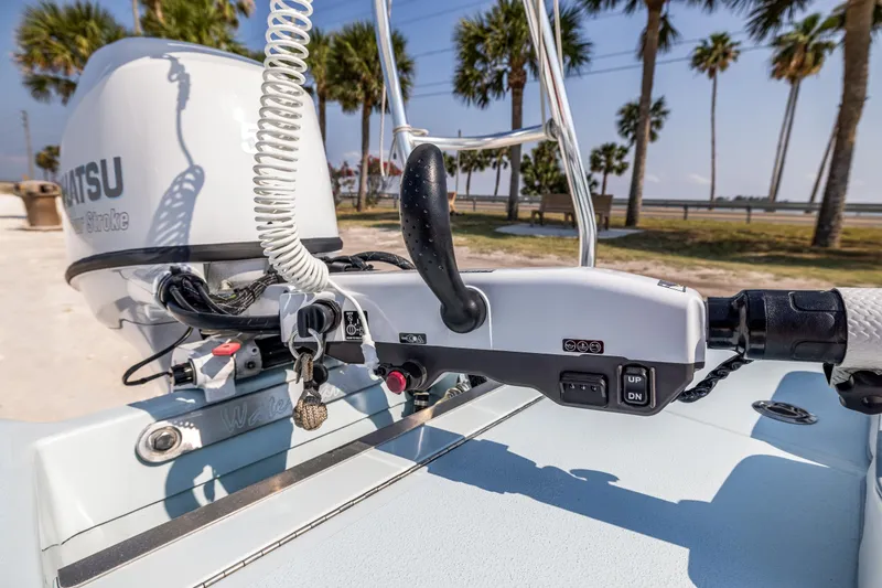 Slide: The Image of Close-up of 2008 Hell's Bay Waterman 16 boat controls with Tohatsu outboard motor. - 14