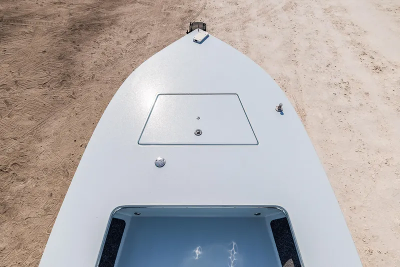 Slide: The Image of 2008 Hell's Bay Waterman 16 boat bow on sandy shore. - 16