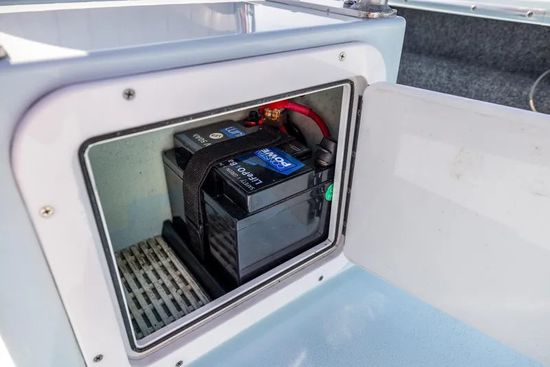 Slide: The Image of Battery compartment of a 2008 Hell's Bay Waterman 16 boat. - 27