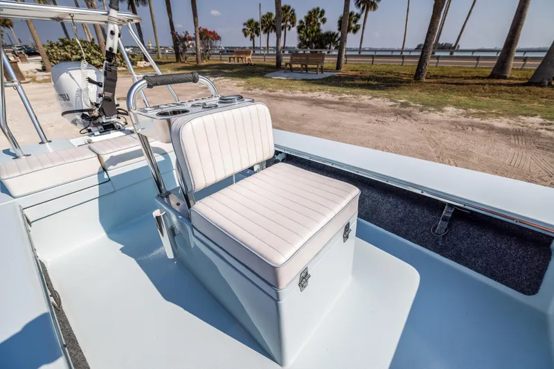 Slide: The Image of 2008 Hell's Bay Waterman 16 boat interior with cushioned seating and console. - 29