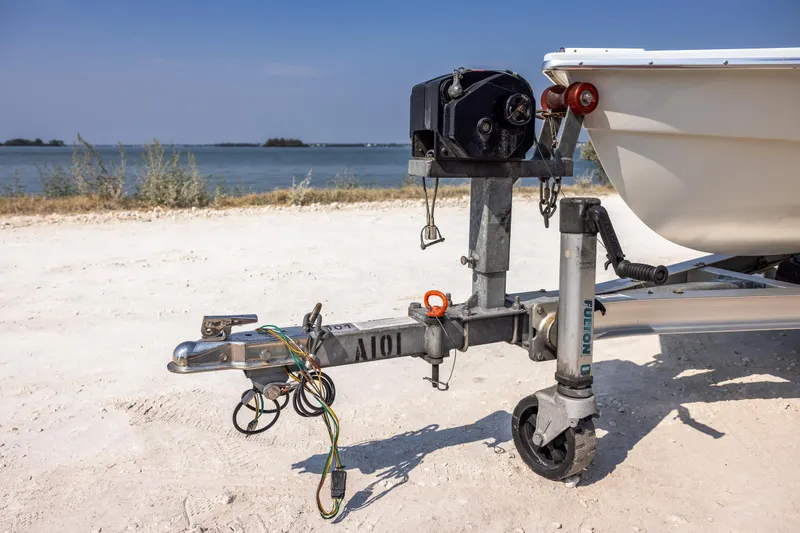 Slide: The Image of 2008 Hell's Bay Waterman 16 boat trailer hitch by the beach. - 3