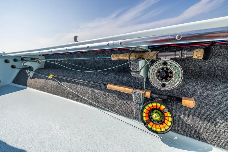 Slide: The Image of Fishing rods and reels on a 2008 Hell's Bay Waterman 16 boat. - 33