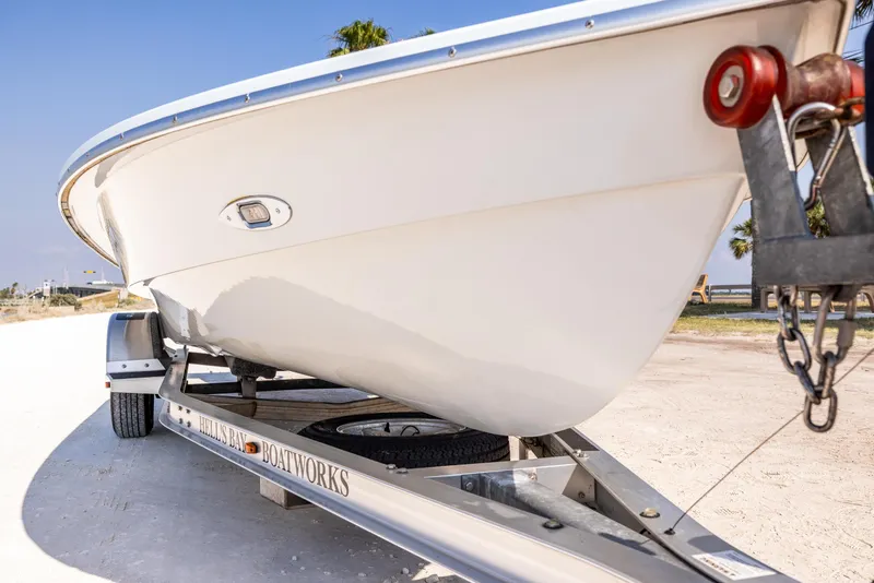 Slide: The Image of 2008 Hell's Bay Waterman 16 boat on a trailer, side view. - 36