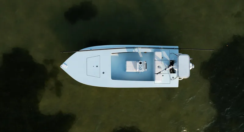 Slide: The Image of Aerial view of a 2008 Hell's Bay Waterman 16 boat on calm water. - 41