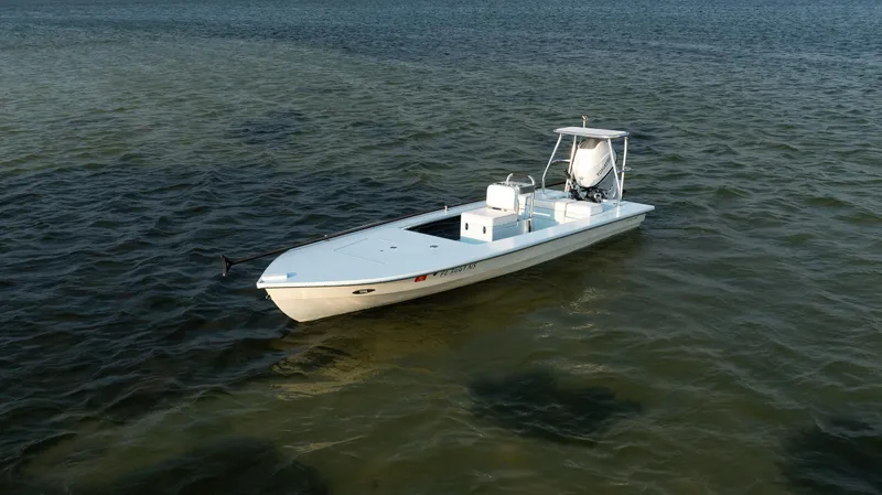 Slide: The Image of 2008 Hell's Bay Waterman 16 skiff boat on calm waters. - 42