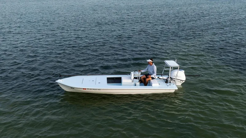 Slide: The Image of 2008 Hell's Bay Waterman 16 boat on open water. - 45