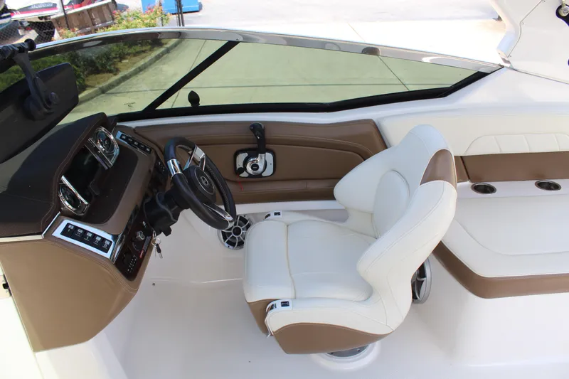Slide: The Image of Interior of a 2016 Chaparral 257 SSX boat with white and brown seating. - 10