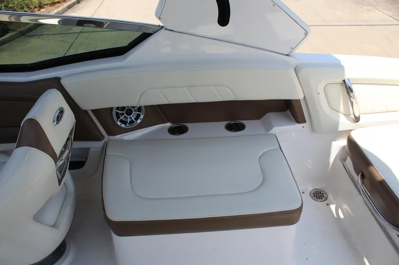 Slide: The Image of Interior of a 2016 Chaparral 257 SSX with white leather seating. - 11