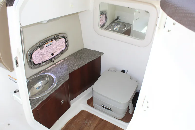 Slide: The Image of Interior of 2016 Chaparral 257 SSX with sink and toilet. - 17